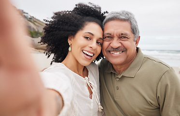 Image showing Portrait, selfie of woman and mature father at beach on vacation, holiday or travel outdoor. Face, picture and dad with adult daughter at ocean for care, happy family bonding or smile together at sea