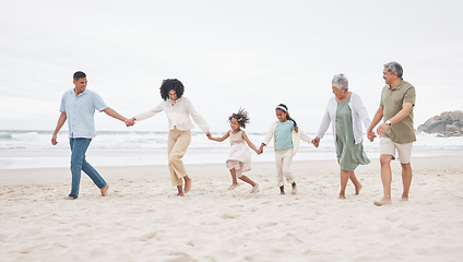 Image showing Big family, walking and holding hands at a beach with support, care and trust in nature. Love, security and children with parents and grandparents at the ocean with solidarity, unity and freedom