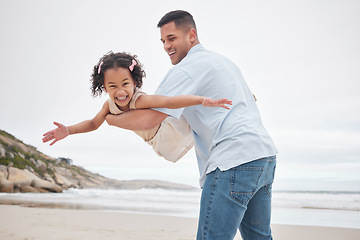 Image showing Airplane, beach and girl child with father in nature happy, bond and having fun together. Flying, freedom and face and kid with parent at the ocean with love, support and games, care or trust outdoor