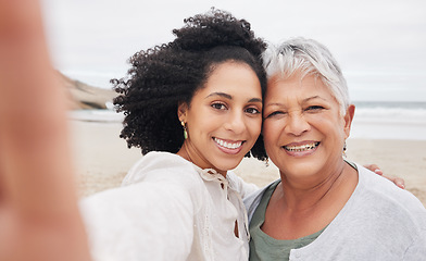 Image showing Family, women and selfie on beach for travel, vacation or adventure in nature with happiness and profile picture. Portrait, mother and daughter together with smile for holiday update by ocean or sea