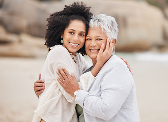 Image showing Portrait, love and woman with senior mother at beach happy, care and hug in nature together. Family, face and female person with elderly mom at the ocean with support, gratitude and trust at the sea