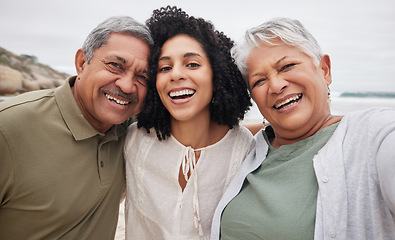 Image showing Portrait, funny woman and senior parents at beach on holiday, vacation or travel outdoor. Face, daughter and elderly mother and father bonding together at ocean for family connection, smile and laugh