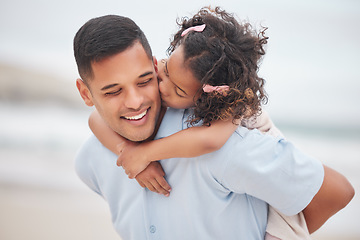 Image showing Kiss, piggyback and a father on the beach with his daughter for travel or vacation on a summer morning. Family, kids and love with happy man carrying his young child outdoor by the sea or ocean