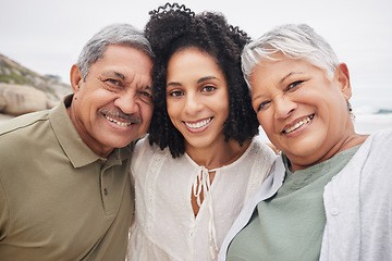 Image showing Portrait, happy woman and elderly parents at beach on holiday, vacation or travel outdoor. Face, adult daughter and mother and father bonding together at ocean for family connection, love and support