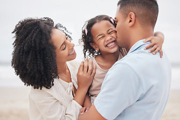 Image showing Beach, hug and mother with father, girl and love with vacation, weekend break and happiness. Family, mama and dad with child, embrace or cheerful with seaside holiday, joyful and travel with bonding