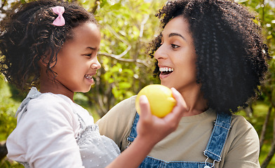 Image showing Happy, lemon and mother with girl, outdoor and happiness with hug, excited and bonding on vacation. Family, mama and kid with mom, child and fruit with a smile, citrus and nutrition with break or joy