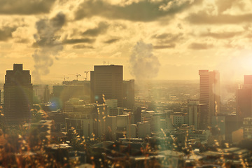 Image showing City, pollution and buildings and smoke, clouds and fumes in urban area, environment and climate change. Emissions, power plants and factories in atmosphere, skyline and danger in toxins, gas or air