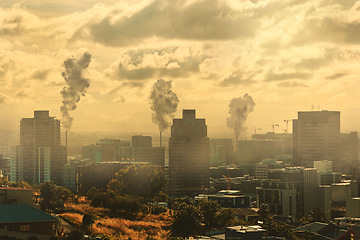 Image showing City, air pollution and gas emissions in sky, urban area and business park with toxic fumes, power plants and energy. Smoke, air and clouds with fog, nature and landscape for steam, vape or danger