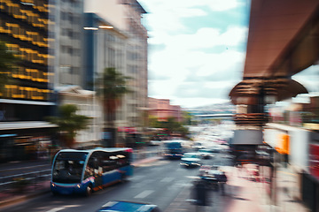 Image showing Busy city, road and cars in motion blur for morning traffic, travel and transportation in CBD. Urban commute, office building and street with bus stop, people on sidewalk and fast journey to work.