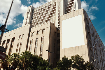 Image showing City, landscape and buildings or skyscraper as infrastructure for corporate space or work. Empty, urban and architecture with marketing, outdoor cityscape and mockup on a banner or poster in town