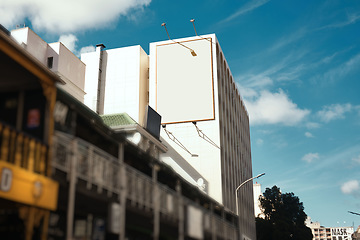 Image showing Building, wall and empty billboard in city with space for advertising, marketing or space on cbd apartment. Blank, poster or mockup for announcement banner with information, branding or promo