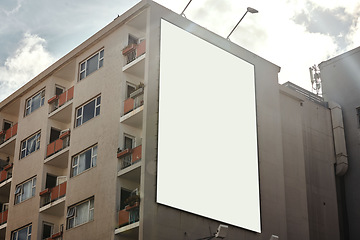 Image showing Apartment building, mockup space and advertising billboard, commercial housing and real estate in city. Empty poster for property marketing, branding and communication with announcement in urban area