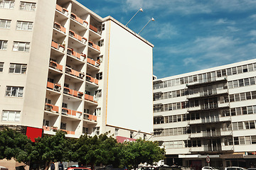 Image showing Building, wall and empty billboard in city with space for advertising, marketing or space on apartment in urban cbd. Blank, post or mockup for announcement banner with information, branding or promo