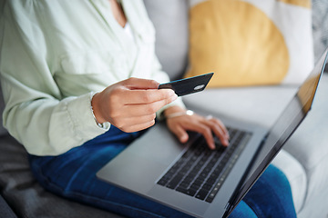 Image showing Hands, laptop and credit card for home online shopping, fintech payment and e commerce on sofa. Closeup of person typing on computer for internet banking, website subscription or application for loan