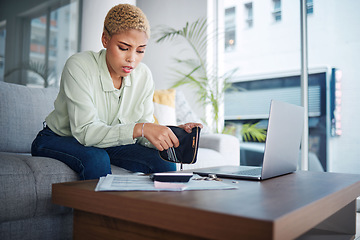 Image showing Home, finance and woman with a laptop, stress and calculator with budget planning, review finances and inflation. Person, paperwork and girl on a sofa, pc or counting with wallet and bankruptcy