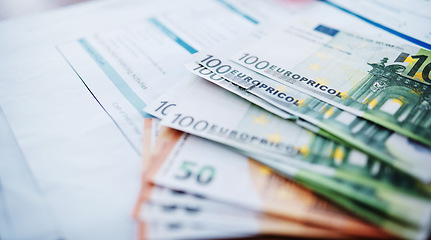Image showing Money, euro and cash for accounting, finance or documents in business, profit or investment on table. Paperwork, savings or salary in bills, expenses or financial growth of income or currency on desk
