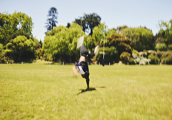 Image showing Cheerleader, blur and cartwheel on field for performance, dance and training outdoor. Cheerleading, moving and energy for workout, motion and fast at event for sport competition, game and acrobat