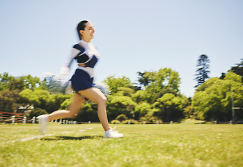Image showing Fitness, cheerleader and woman running on a field for match motivation, energy or performance. Sports, runner and cheerleading female with freedom at a park for game training, practice or competition