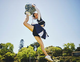 Image showing Fitness, jump and woman cheerleader on a field for motivation or support practice with team. Sports, cheerleading and female athlete training for skill and dance with energy at competition or match.