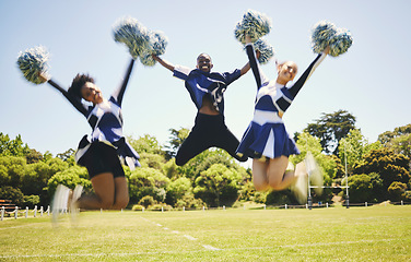 Image showing Cheerleader team, smile and people jump for performance on field outdoor in training, celebration or exercise. Happy, cheerleading group and energy for support at event, sport competition and blur