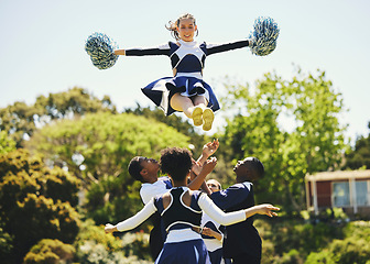 Image showing Teamwork, air or girl cheerleader training in fitness workout, exercise or learning routine on field. Jump, dance or sports woman in group for motivation, inspiration or support on college campus