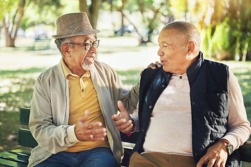 Image showing Talking, senior and friends in a park for bonding, communication or together in retirement. Happy, elderly and men speaking with care, smile and enjoying conversation in nature interaction to relax