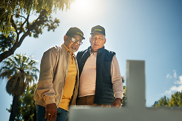 Image showing Senior veteran men, tombstone and respect for military, navy or memorial in cemetery for grief, support or empathy. Elderly friends, gravestone and together with thinking, memory and love for soldier