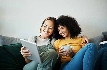 Image showing Relax, happy and a lesbian couple with a tablet on the sofa for social media, internet or a movie. Coffee, house and gay or lgbt women with technology for streaming a film or show on the couch