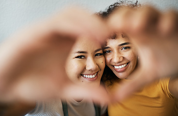 Image showing Heart, hands and portrait of happy lesbian couple for care, trust and support in relationship at home. Love sign, face and gay women together in commitment to marriage, connection and LGBTQ or emoji