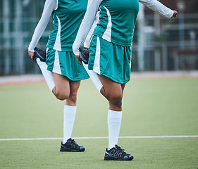 Image showing Team, stretching legs and exercise on field, sports and uniform for match, balance and teamwork together. Training with athletes, outdoor and fitness to prepare for game, workout for performance