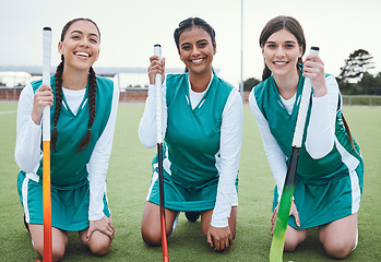 Image showing Portrait, smile and hockey with a woman team outdoor on a field for sports, a game or competition together. Fitness, exercise and diversity with a happy young athlete group on an astro turf court