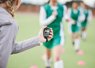 Image showing Hands, coach or team with timer on field to monitor time, fitness training or exercise progress. Hockey, performance blur or fast sports athlete with stop watch to check running workout or wellness