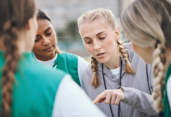 Image showing Leader, sports coach or team planning tactics or strategy in a hockey training game, conversation or match. Women, talking or athletes in practice for fitness exercise together for teamwork in group