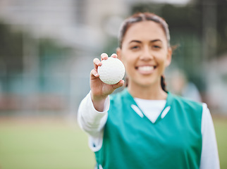 Image showing Female, person and smile for hockey with ball in hand on field for competition, match or workout. Girl, happy and confident with sports, equipment or gear for game, training and health for wellness