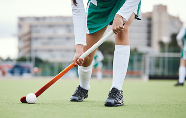Image showing Fitness, legs and hockey stick with a sports person on a court or field during a game for competition. Exercise, grass and ball with a player training at practice on astro turf for health or wellness