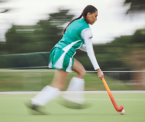 Image showing Hockey, speed or woman running in game, tournament or training with ball, stick or action on turf. Blur, sports or fast girl player in exercise, workout or motion on artificial grass for fitness