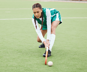 Image showing Hockey, sports or girl on turf in fitness training, game or competition with ball, stick or action. Strong woman, athlete or female player in exercise, workout or motion on artificial grass for power