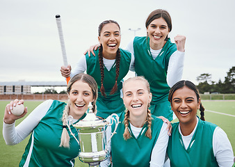 Image showing Women, hockey team and winning trophy in portrait, celebration and success in competition on field. Champion girl group, friends and diversity for sports, goal or happy outdoor at stadium for contest