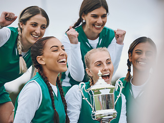 Image showing Sports women, team and trophy in celebration, winning and fist in air for competition on field. Champion girl group, friends and diversity for hockey, goals and happy outdoor at arena for contest