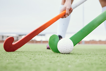 Image showing Hockey stick, sports or people on turf in a game, tournament or competition with ball or action. Fitness, athletes training or players in exercise, workout or closeup on artificial grass or ground