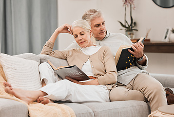 Image showing Old people on couch, reading book and relax together at home, retirement and wellness with love and comfort. Trust, care and support in marriage, share hobby with partner for knowledge and story