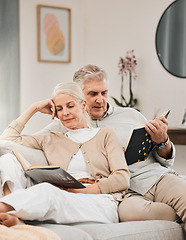 Image showing Old couple, reading book and couch in home for learning relax or retirement, storytelling or happiness. Elderly people, sofa or lounge for connection or information, knowledge or bonding in apartment