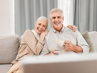 Image showing Old people, home and watching tv with coffee and happiness together in retirement with comedy and partner. Love, care and online streaming, funny tv show with tea and couple relax on couch for movie