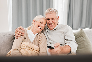 Image showing Senior couple, tv and laughing with love on a living room sofa with smile and movie at home. Elderly people, bonding and marriage in retirement with series and streaming in lounge on a couch together