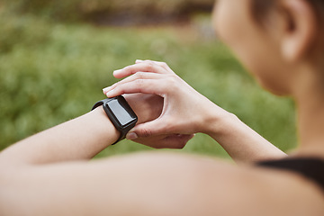 Image showing Hands, runner girl and check smart watch in park for steps, data or time app with results, fitness or nature. Woman, iot clock or monitor for speed, sport or reading for exercise, workout or health