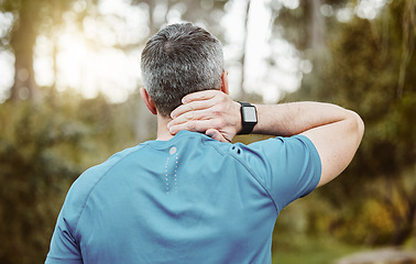 Image showing Back of a man, neck pain and outdoor for fitness, wellness and exercise in a park with injury. Morning, mature athlete accident and strain in nature with workout and sports inflammation of the spine