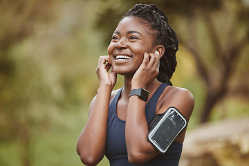 Image showing Fitness, smile and black woman listening to music outdoor exercise, workout or training in a forest for wellness. Happy, confident and young person ready and enjoy radio, audio or podcast in nature