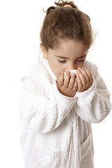 Image showing Little girl sniffing fragrant soap