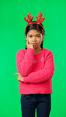 Image showing Christmas, thinking and portrait of girl on green screen with arms crossed for idea, thoughts and wondering. Festive, decor and child in studio brainstorming for holiday, celebration and Santa list