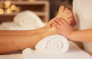 Image showing Pedicure, foot therapist and massage at spa for acupressure treatment, wellness therapy and zen. Closeup, client and relax feet at beauty salon for muscle reflexology, circulation or skincare service